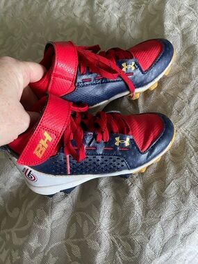 Under Armour Kids Red and Navy Baseball Cleats with Gold Accent